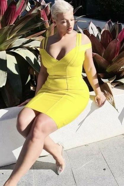 Woman wearing a figure flattering  Sia Bandage Dress - Pearl White Bodycon Collection