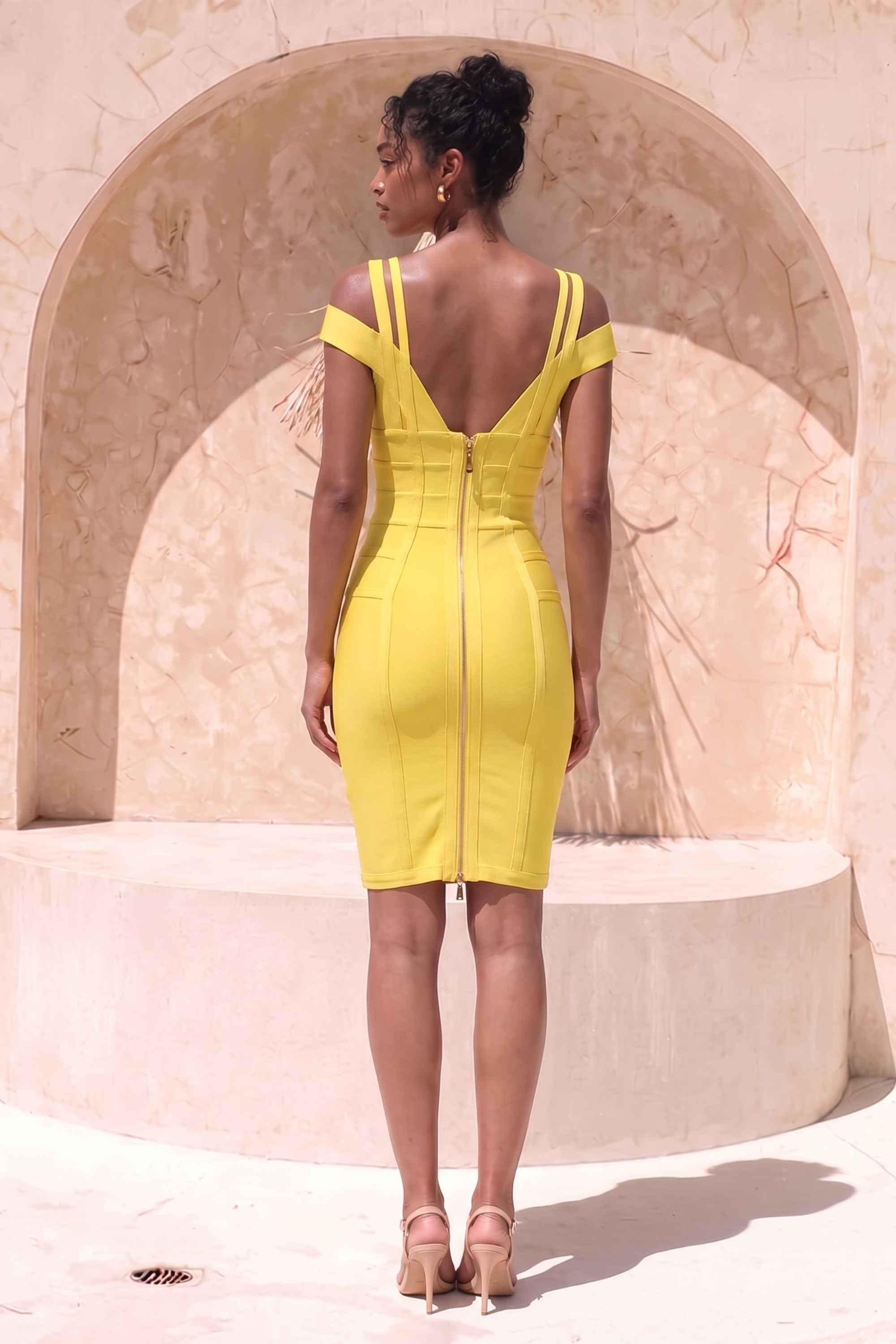 Woman wearing a figure flattering  Sia Bandage Dress - Sun Yellow Bodycon Collection