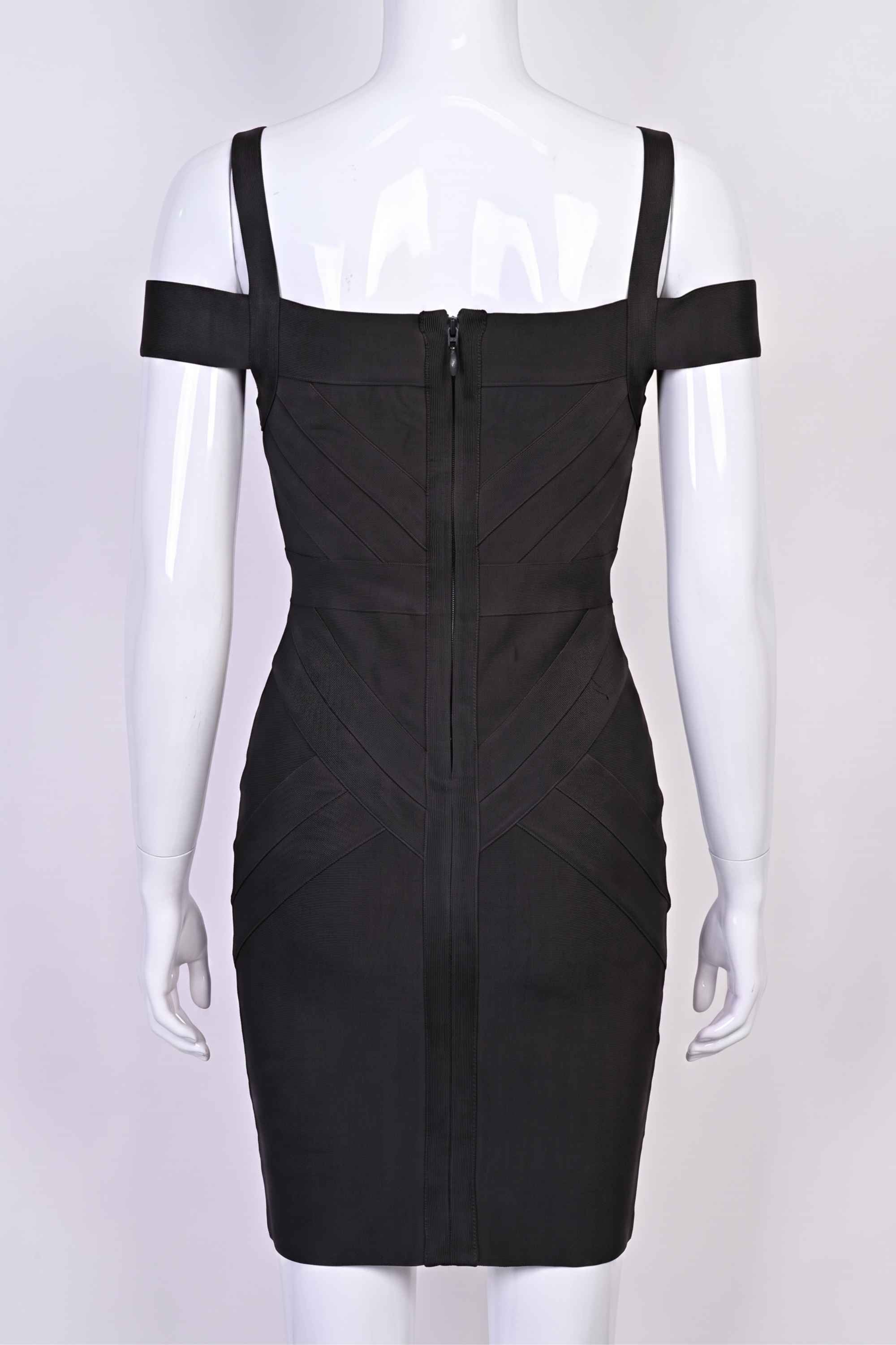 Woman wearing a figure flattering  Sophia Bandage Dress - Classic Black Bodycon Collection