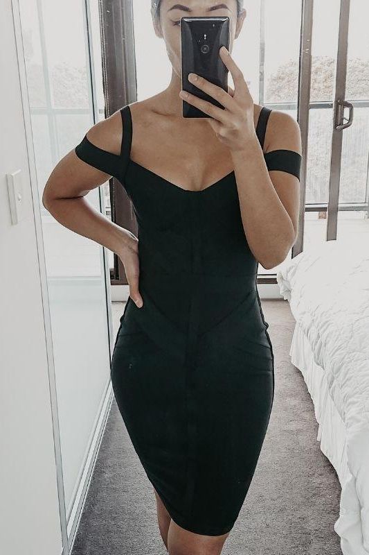 Woman wearing a figure flattering  Sophia Bandage Dress - Classic Black Bodycon Collection