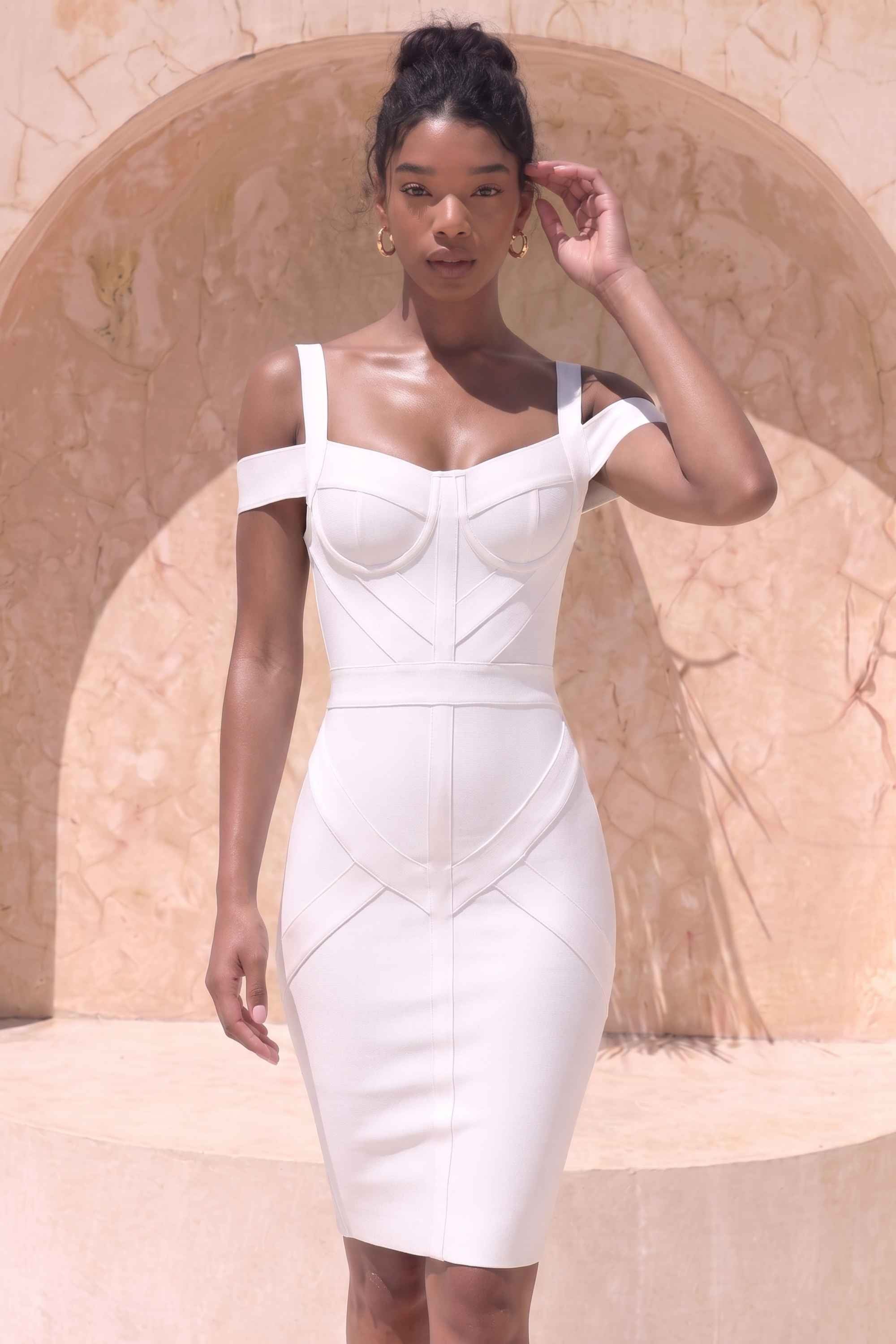 Woman wearing a figure flattering  Sophia Bandage Dress - White Pearl Bodycon Collection