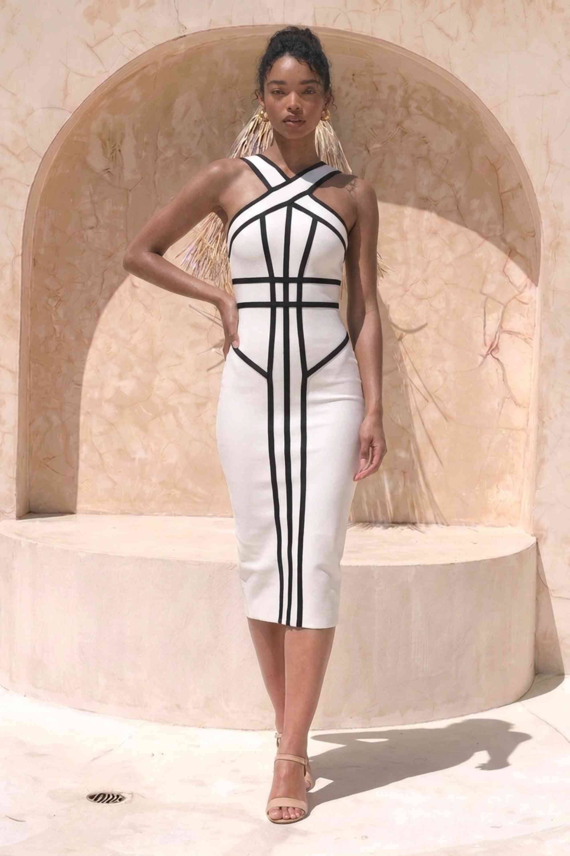 Woman wearing a figure flattering  Suki Bandage Midi Dress - White Pearl BODYCON COLLECTION