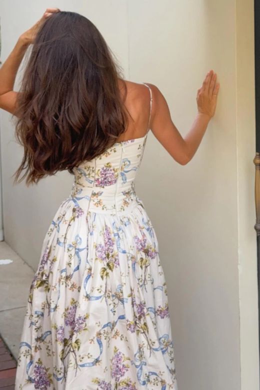 Woman wearing a figure flattering  Tasmin Bodycon Midi Dress - White Floral BODYCON COLLECTION